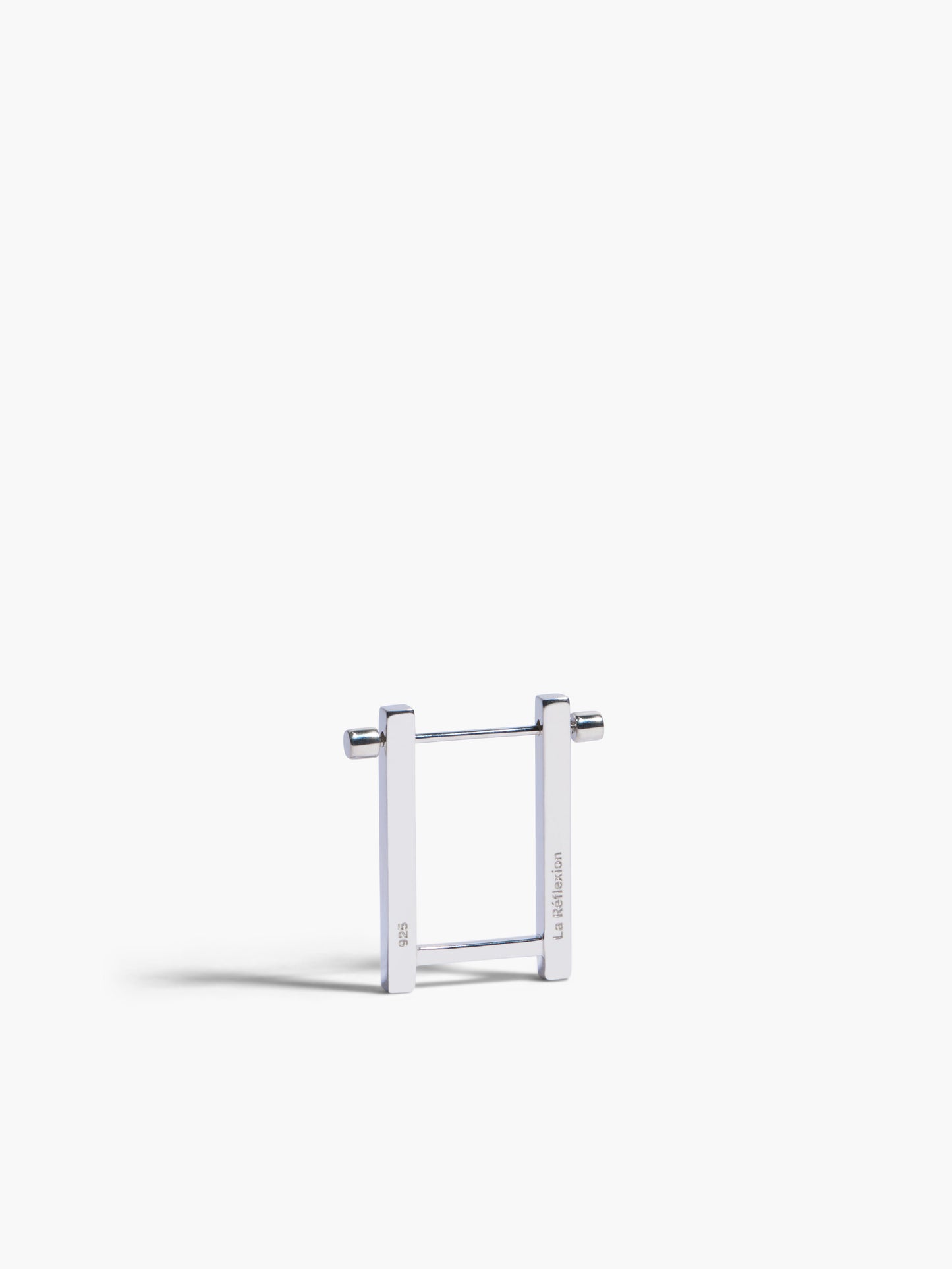 Metallic square frame earrings on a white background