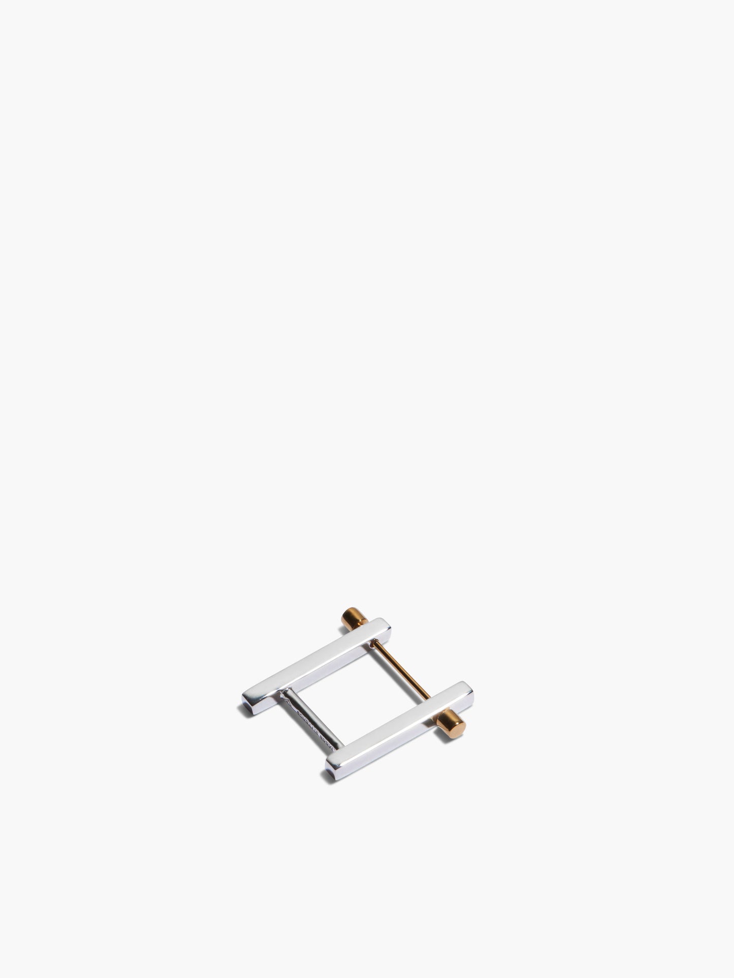 Small metal frame earrings on a white background