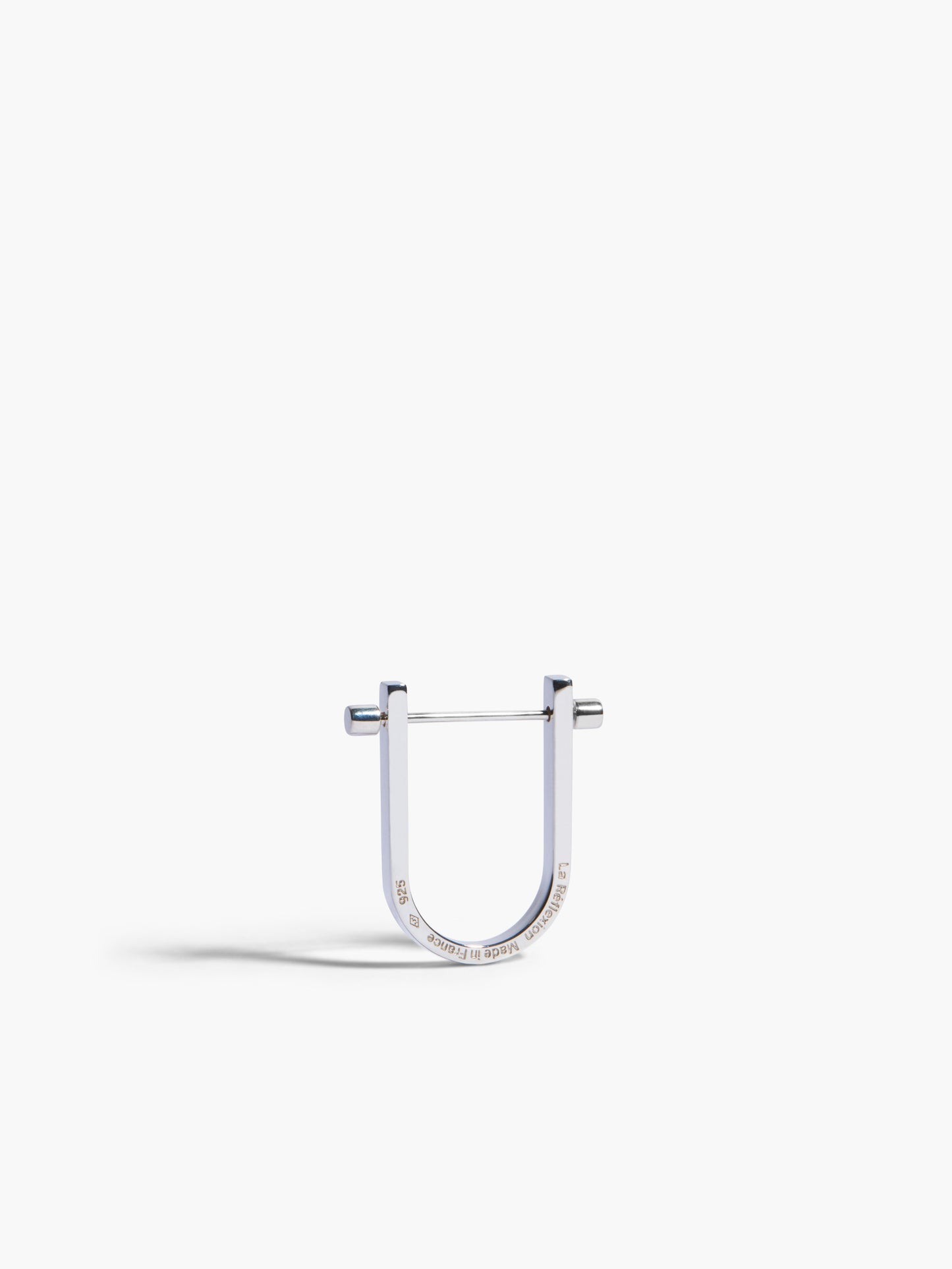 Silver U-shaped earring on a white background