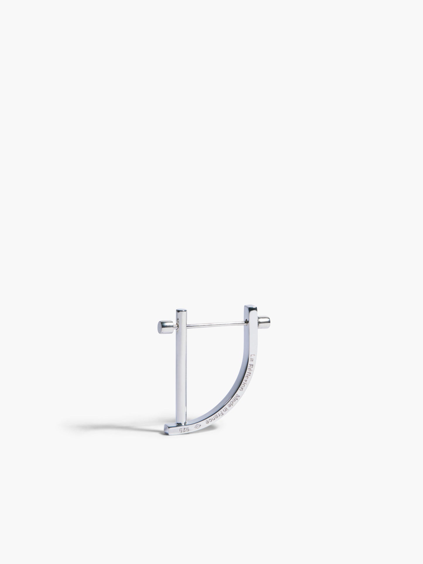 Silver hoop earring on a white background