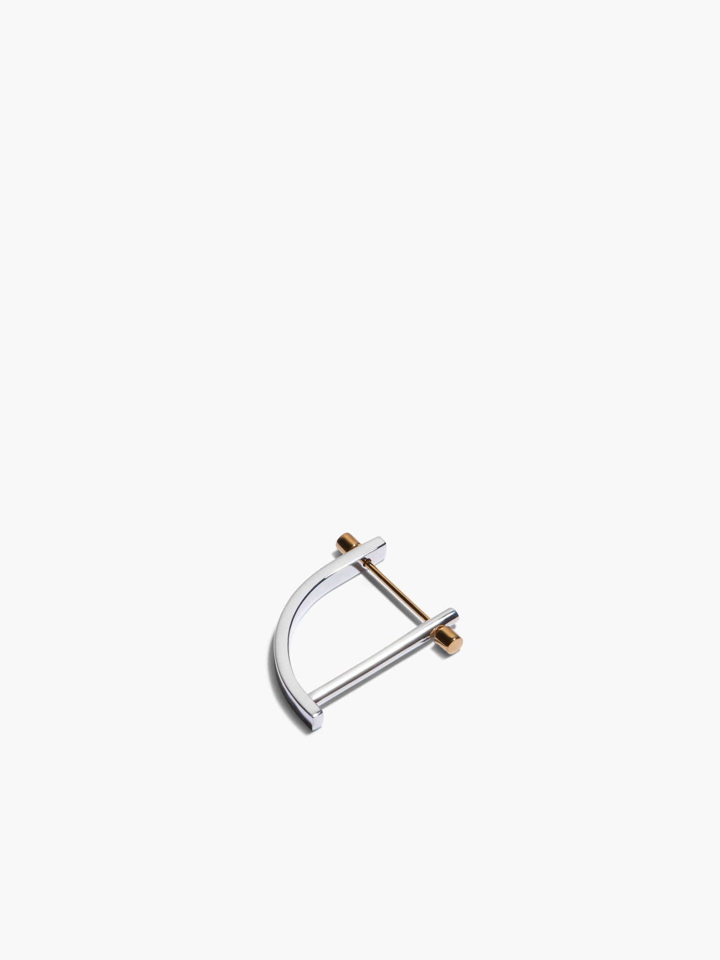 Gold and silver earring on a white background