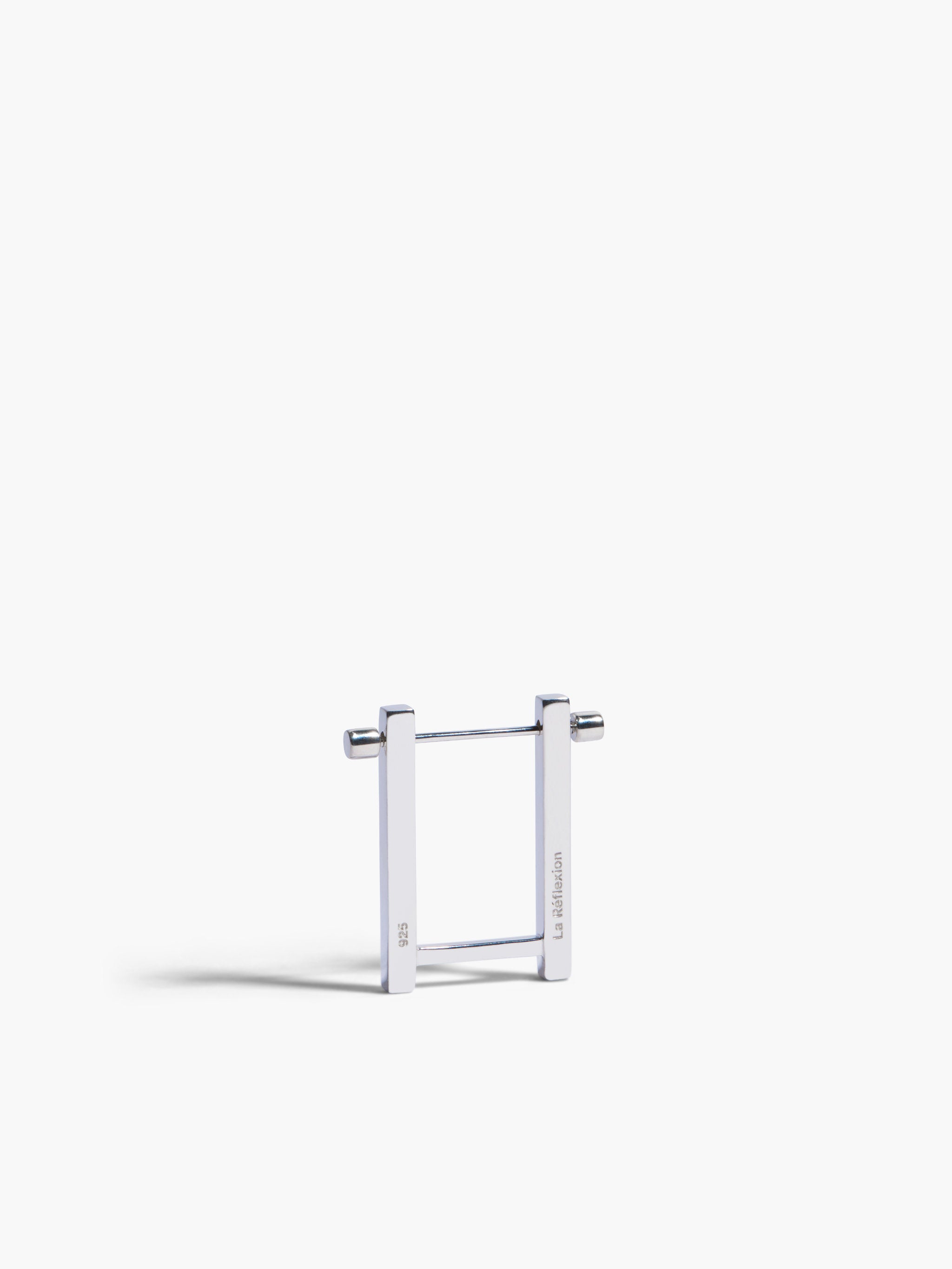 Metallic square frame earrings on a white background