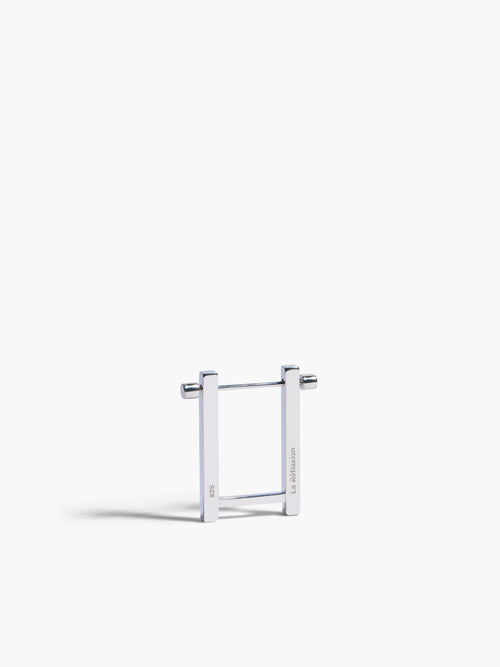 Metallic square frame earrings on a white background