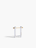 Gold and clear square-shaped earring on a white background