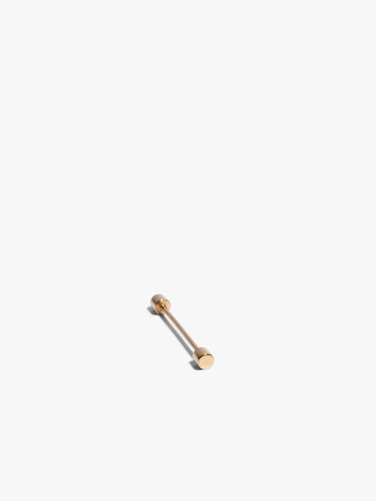 Gold earring on a white background