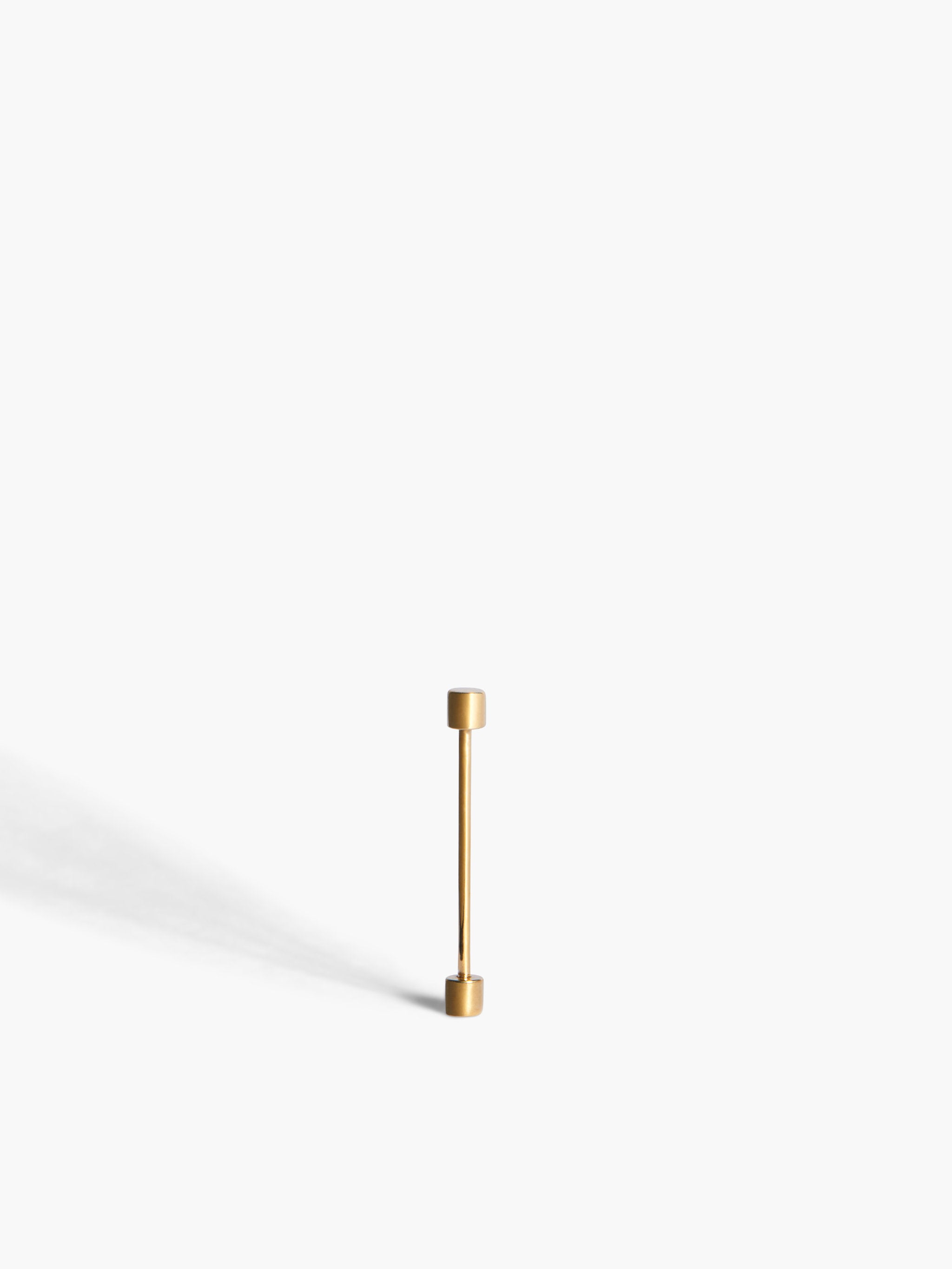 Gold earring on a white background
