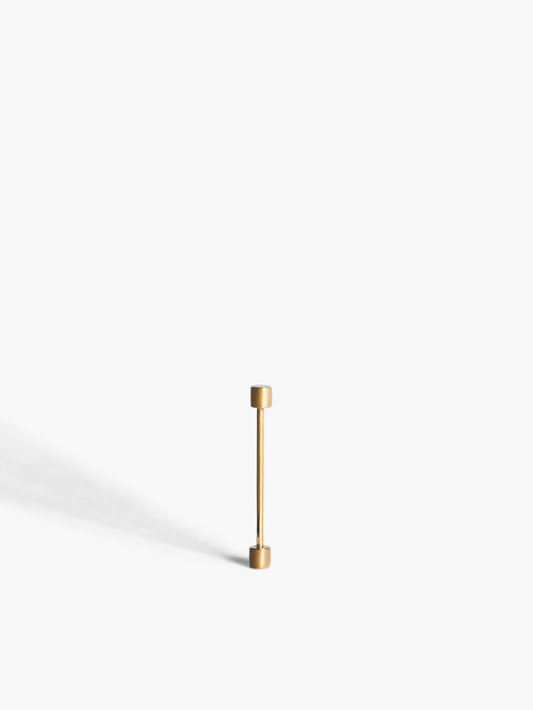 Gold earring on a white background