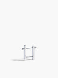Silver earring on a white background
