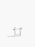 Gold and silver earring on a white background