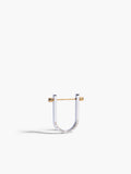 Silver and gold U-shaped earring on a white background