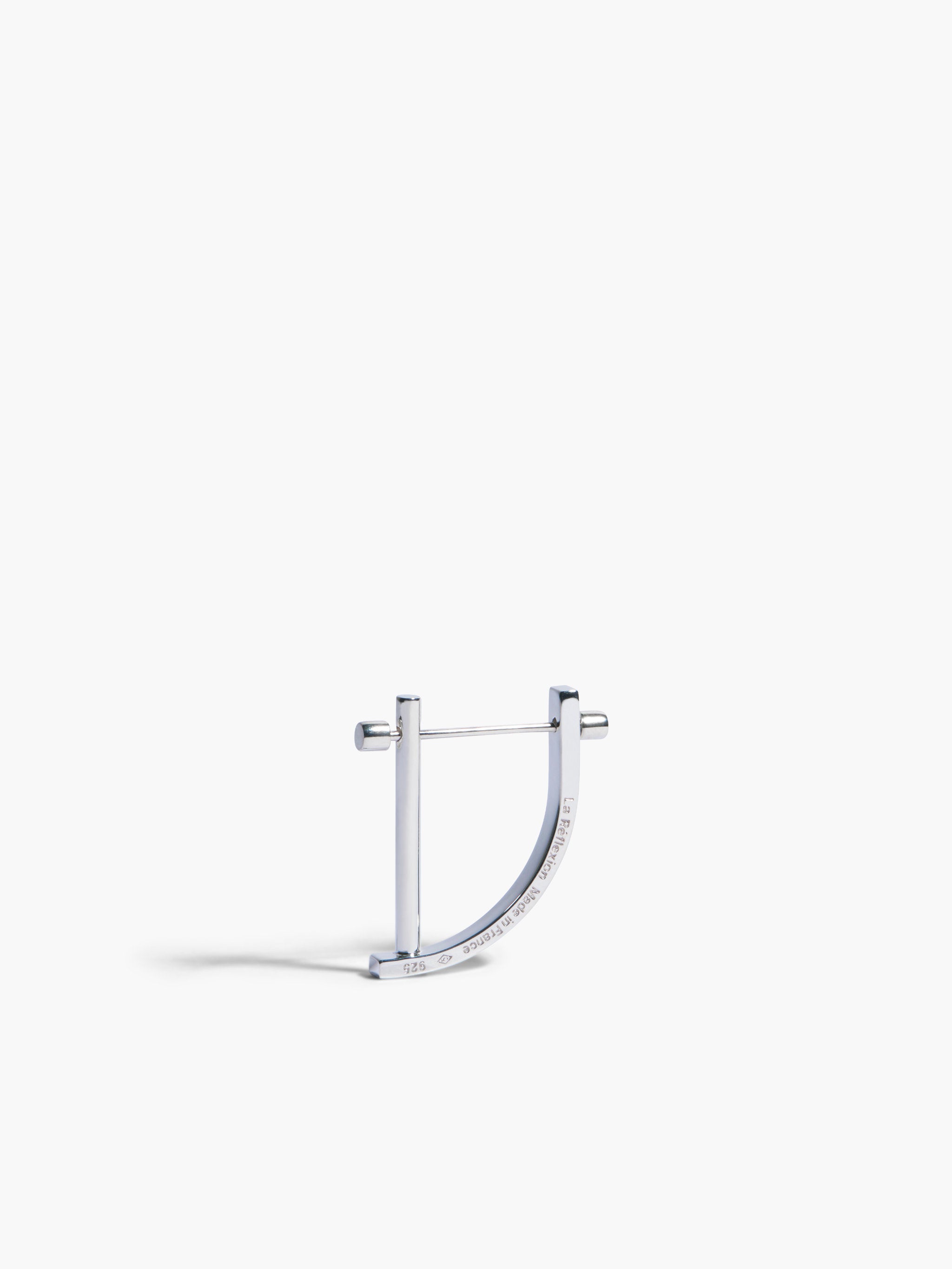 Silver hoop earring on a white background