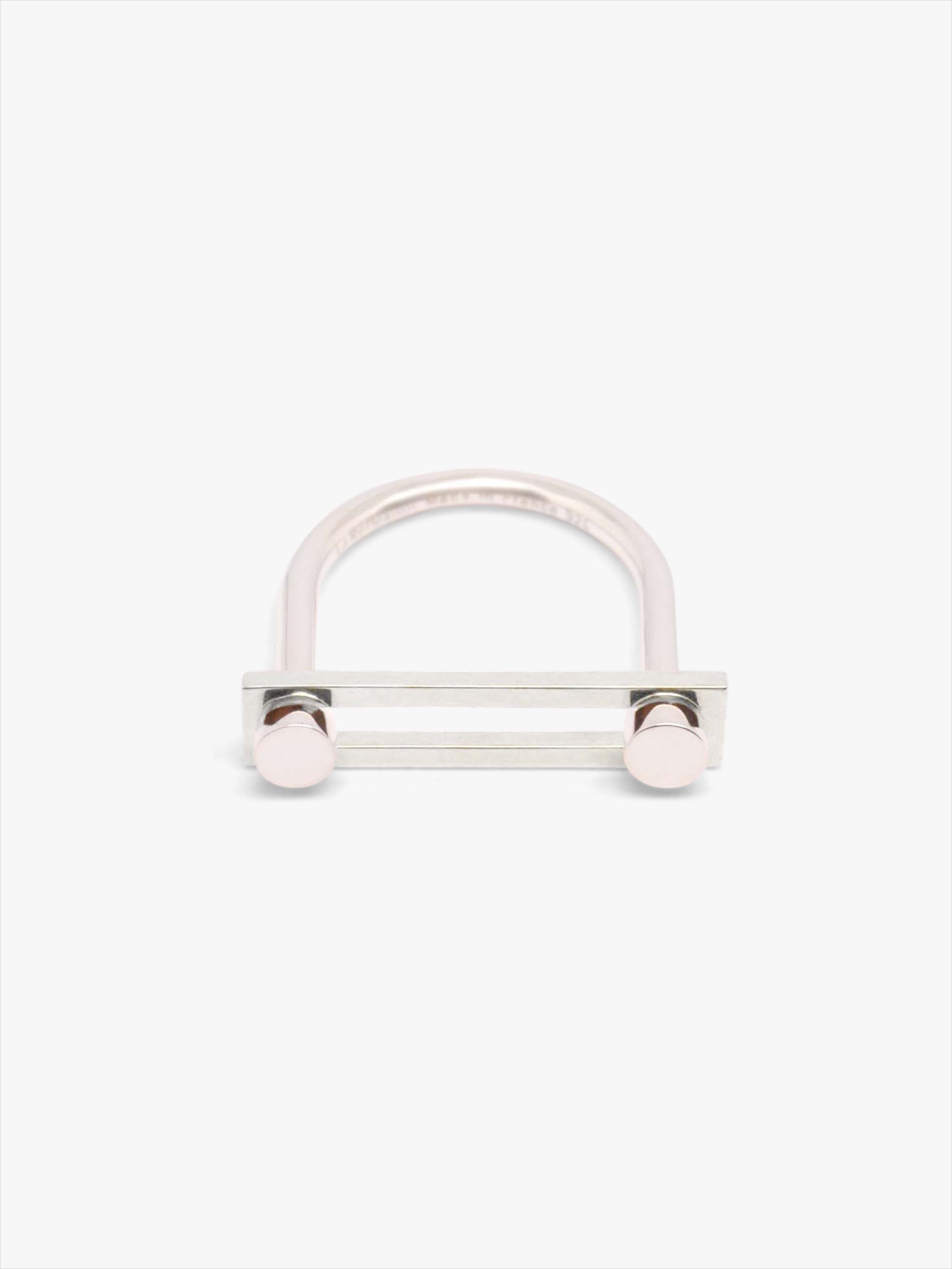 Silver ring with a round bar on a white background